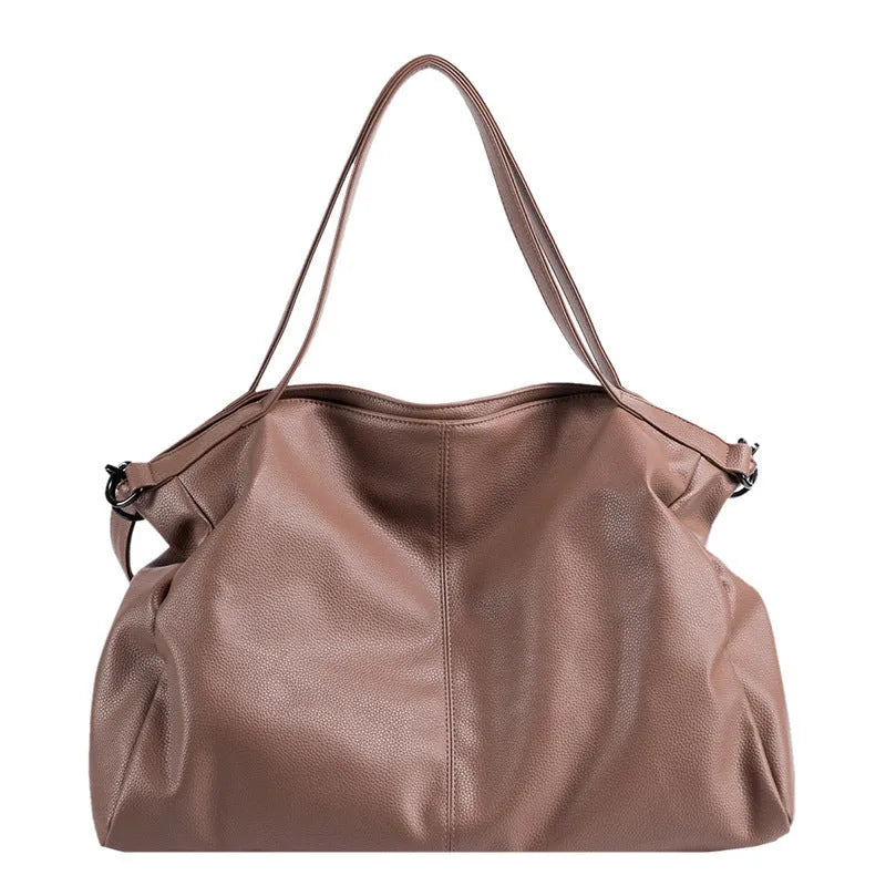 Large soft surface messenger bag in horizontal square shape with adjustable shoulder strap and zipper opening