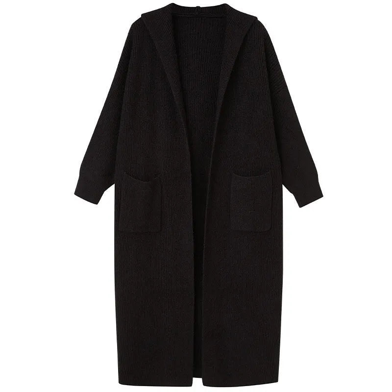 Long grey knitted hooded trench coat shown on a model, cardigan style with long sleeves.