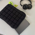 Large black nylon laptop bag open showing interior compartments for 15.6 inch computer