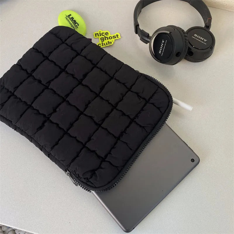 Large black nylon laptop bag open showing interior compartments for 15.6 inch computer