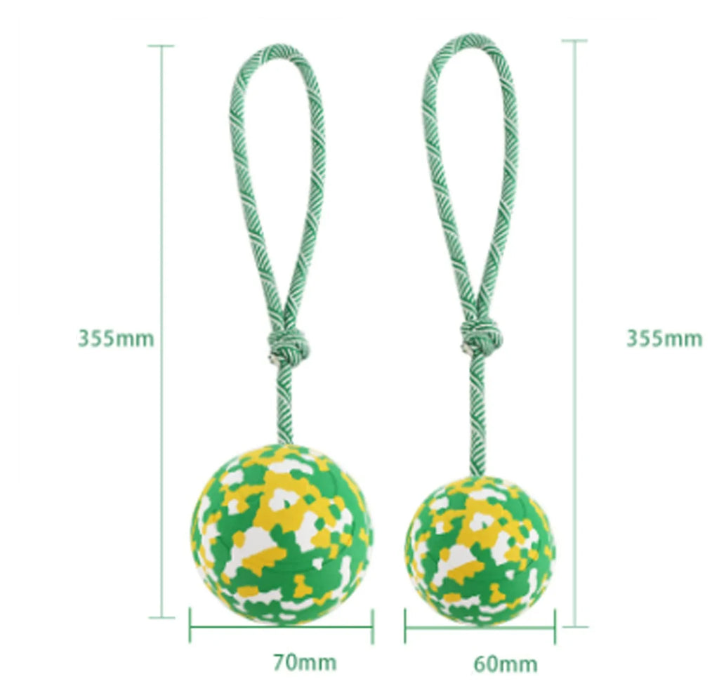 S size natural rubber dog chew ball attached to a blue nylon rope for fetch and tug toys