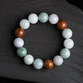 Natural Myanmar jade bracelet with three colours on 13mm round beads showing traditional craftsmanship