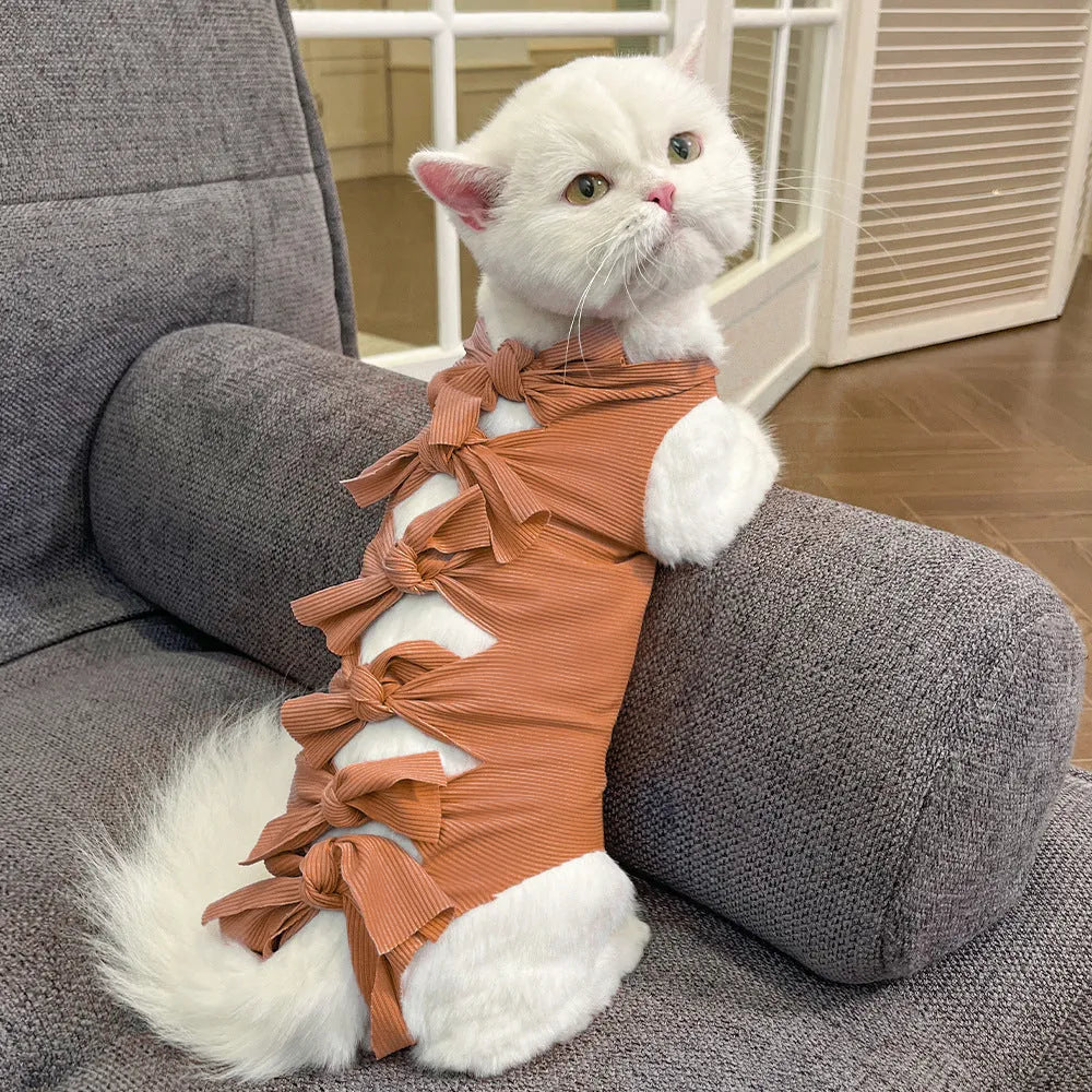 Lace-up polyester cat recovery suit for post-surgery care in blue, shown on a cat mannequin.