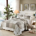 Pure cotton quilted bedspread three-piece set with pillowcases on a bed