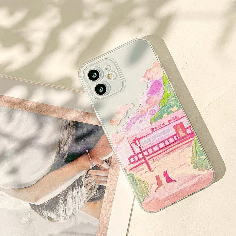 Soft silicone iPhone case with a colourful two-cat cartoon design on a white background.