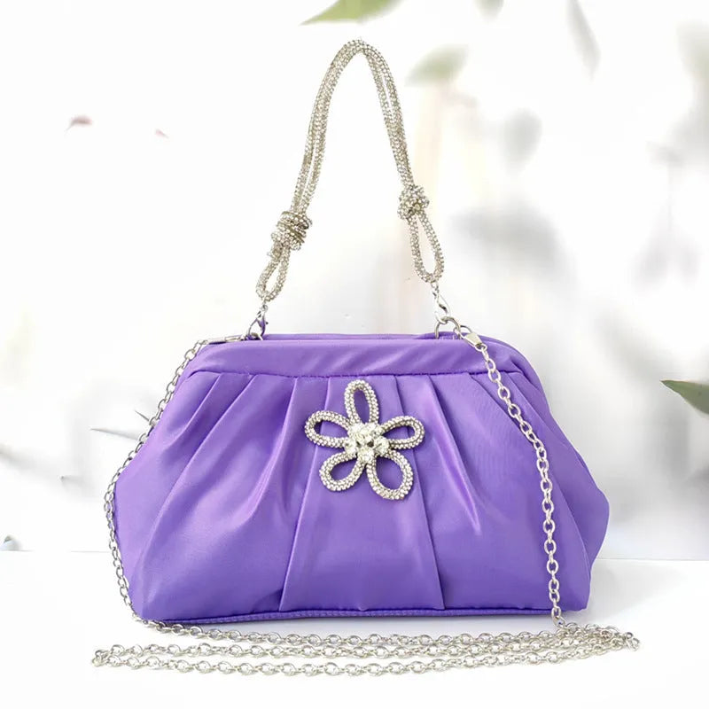 Women's soft polyester messenger bag with chain detailing and diamond pattern in black colour