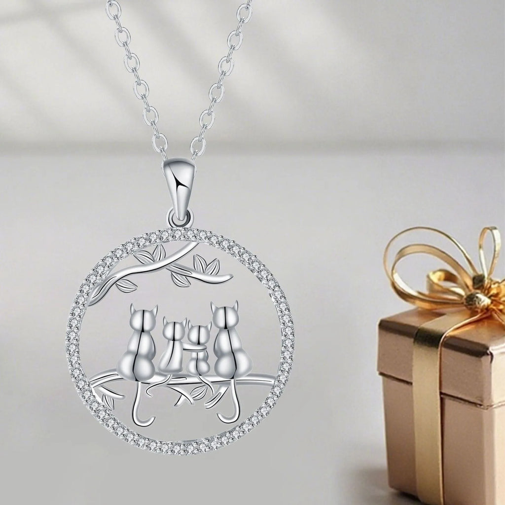 Women's copper necklace with an electroplated pendant showing four kittens on a cross chain.