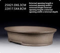 Handmade purple sand ceramic bonsai pot with antique oval design measuring 25x21x6.3cm