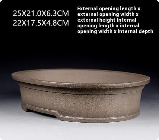 Handmade purple sand ceramic bonsai pot with antique oval design measuring 25x21x6.3cm