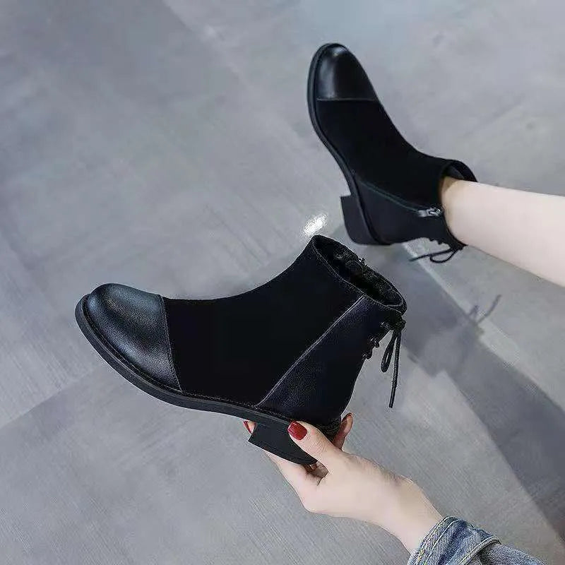 Black women's Martin Boots with knee-length design, side zip closure, and decorative bow detail