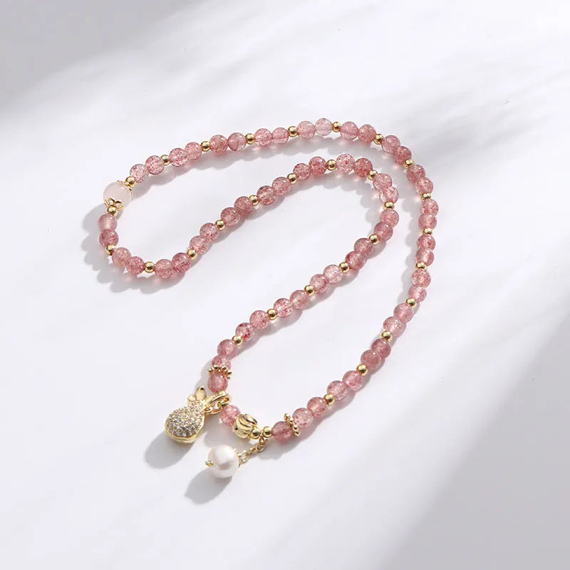 Women's strawberry quartz crystal bracelet with a geometry shape design.