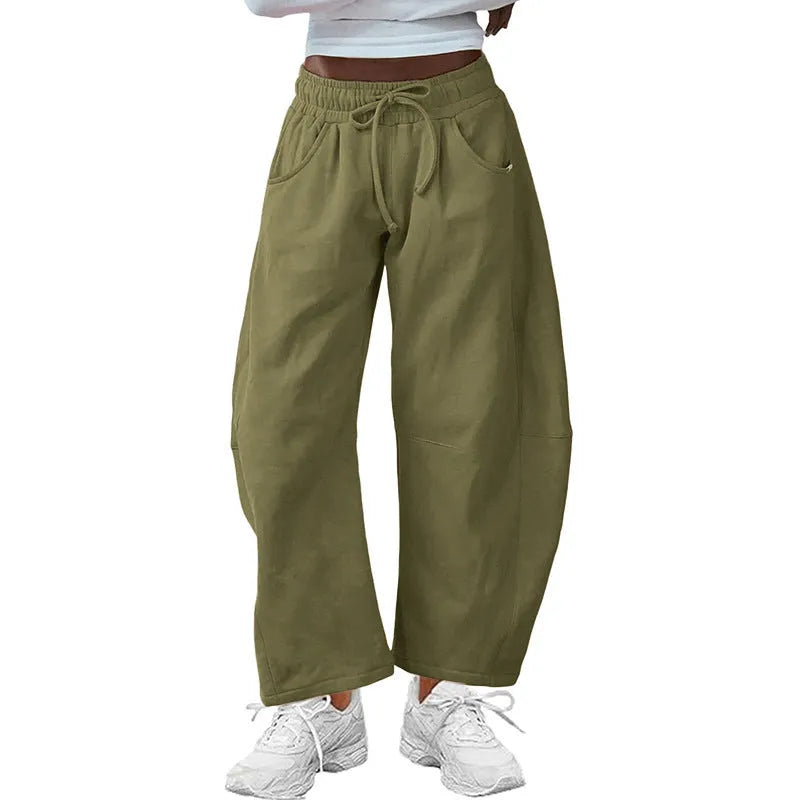 Loose cropped sweatpants with drawstring elastic waist in street fashion styling