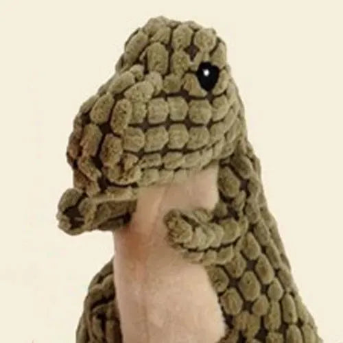 Set of four grey, green, and orange dog toys with sound features for chewing and training