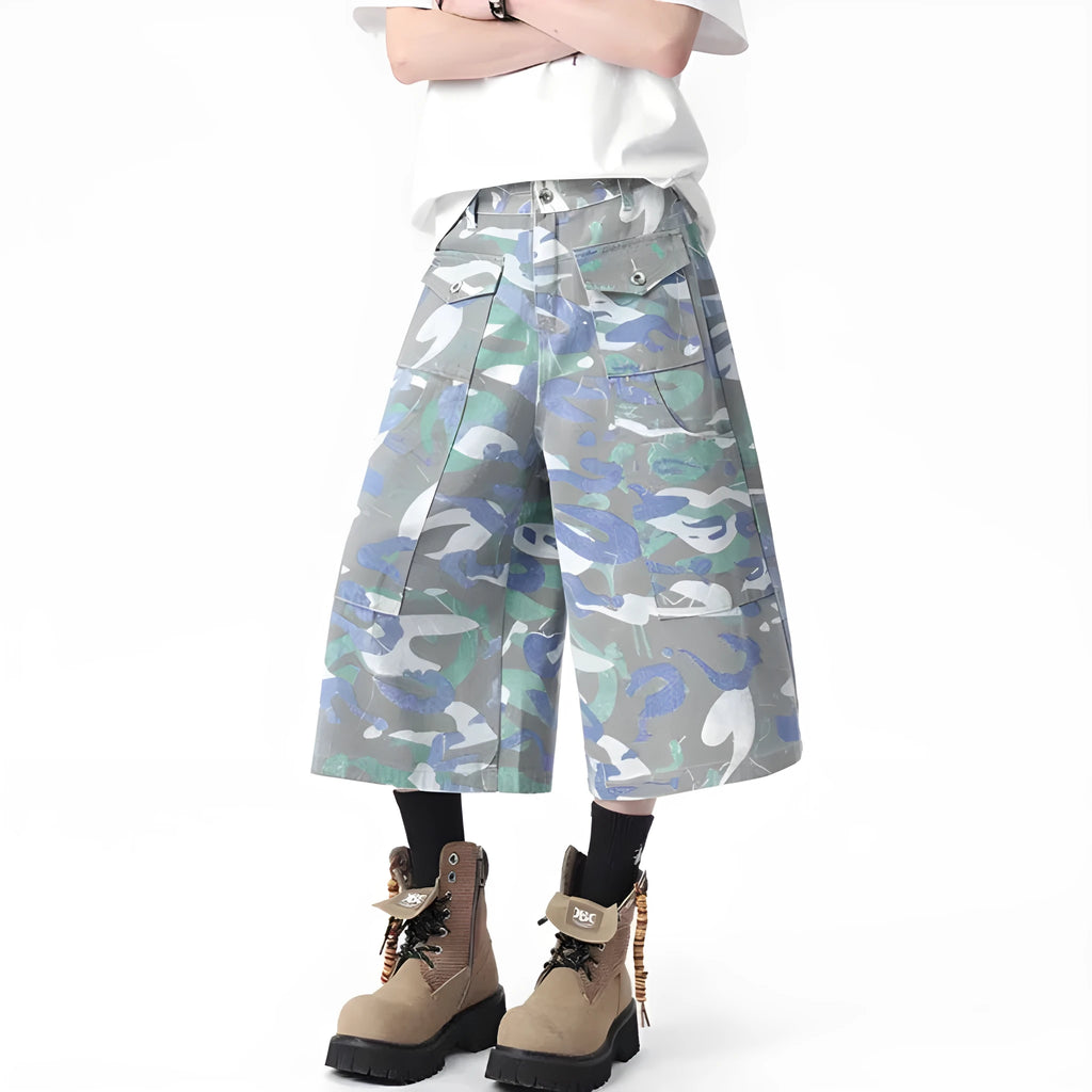 Men's camouflage colour denim cropped cargo trousers on a plain background