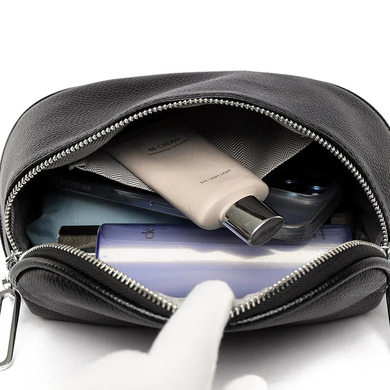 A soft black PU leather women's messenger bag with a single strap, shown in a casual saddle shape.