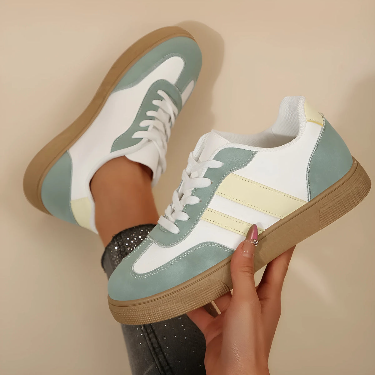 Green women's retro sports shoes with cross strap detail and round toe