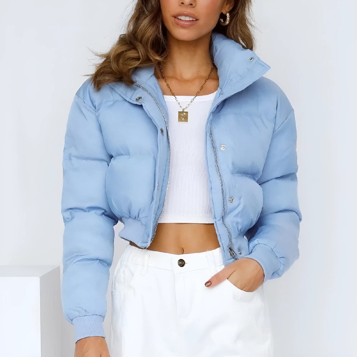 Loose fit women's polyester jacket in beige, black, or blue colour with long sleeves.