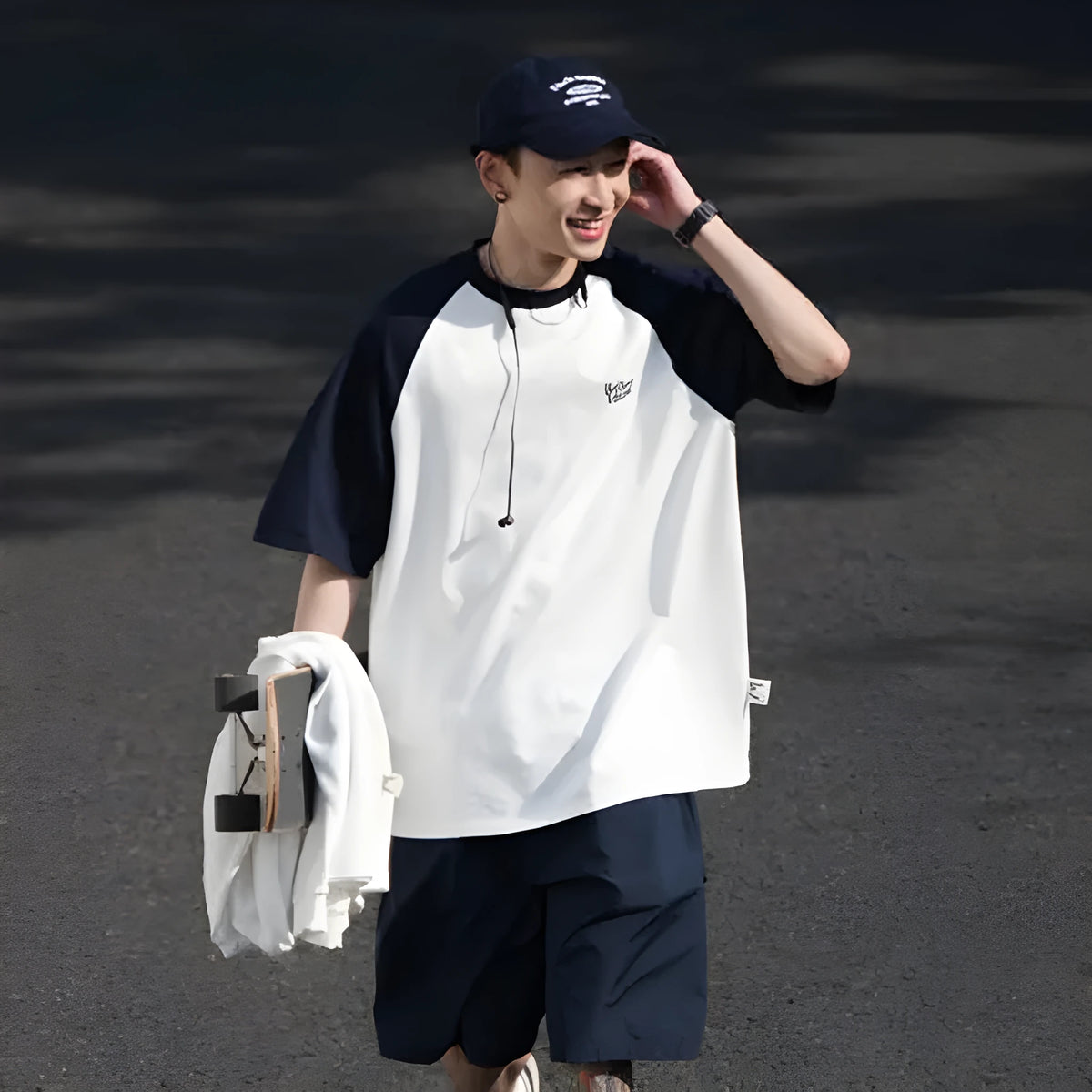 Men's blue loose-fit casual t-shirt with raglan sleeves on a hanger.