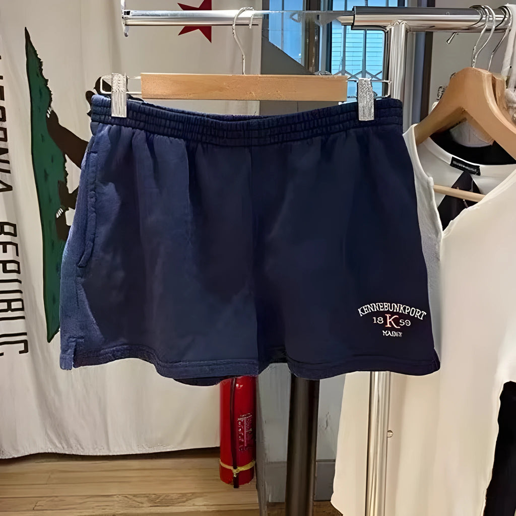 Dark blue cotton athletic hot pants with white flag embroidery and navy blue panels