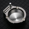 Large blue metal ashtray with integrated permanent match lighter and three cigarette slots.