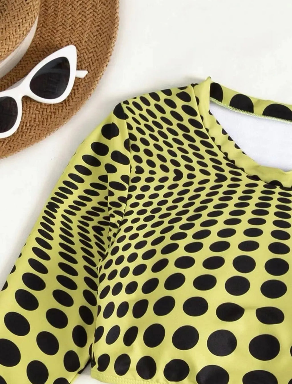 Women's green polka dot three-piece swimsuit set with halterneck bikini top and matching skirt