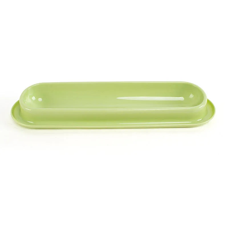 Green leakproof pet bowl with stainless steel interior and non-slip silicone base for dogs and cats.