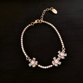Women's gold colour copper bracelet with geometric quadrilateral design and inlaid zircon stones