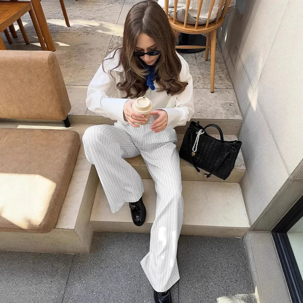 White striped wide-leg commuting trousers with zipper detailing on hanger