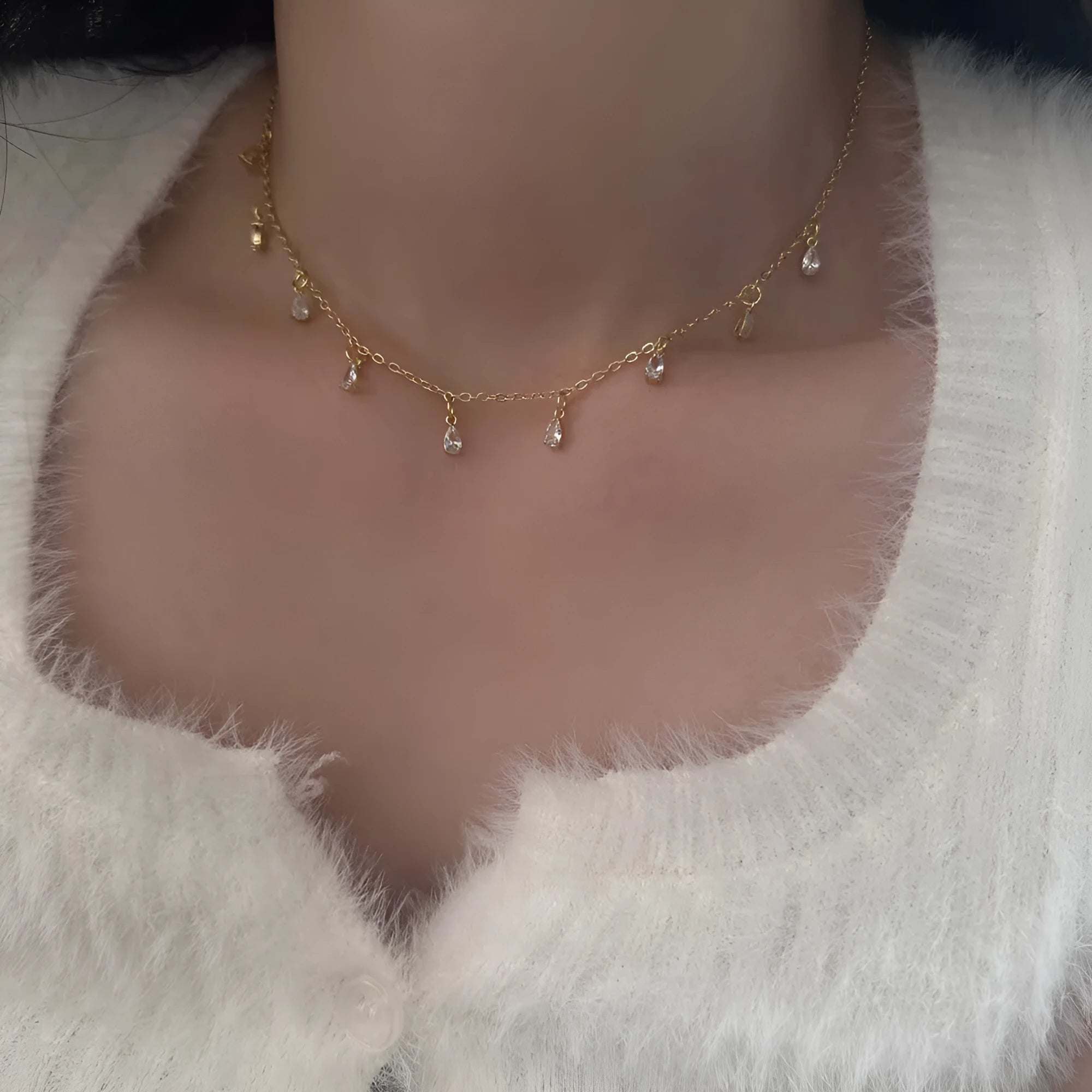 Women's zircon jewellery set showing geometric meteor shower necklace, earrings, and anklet