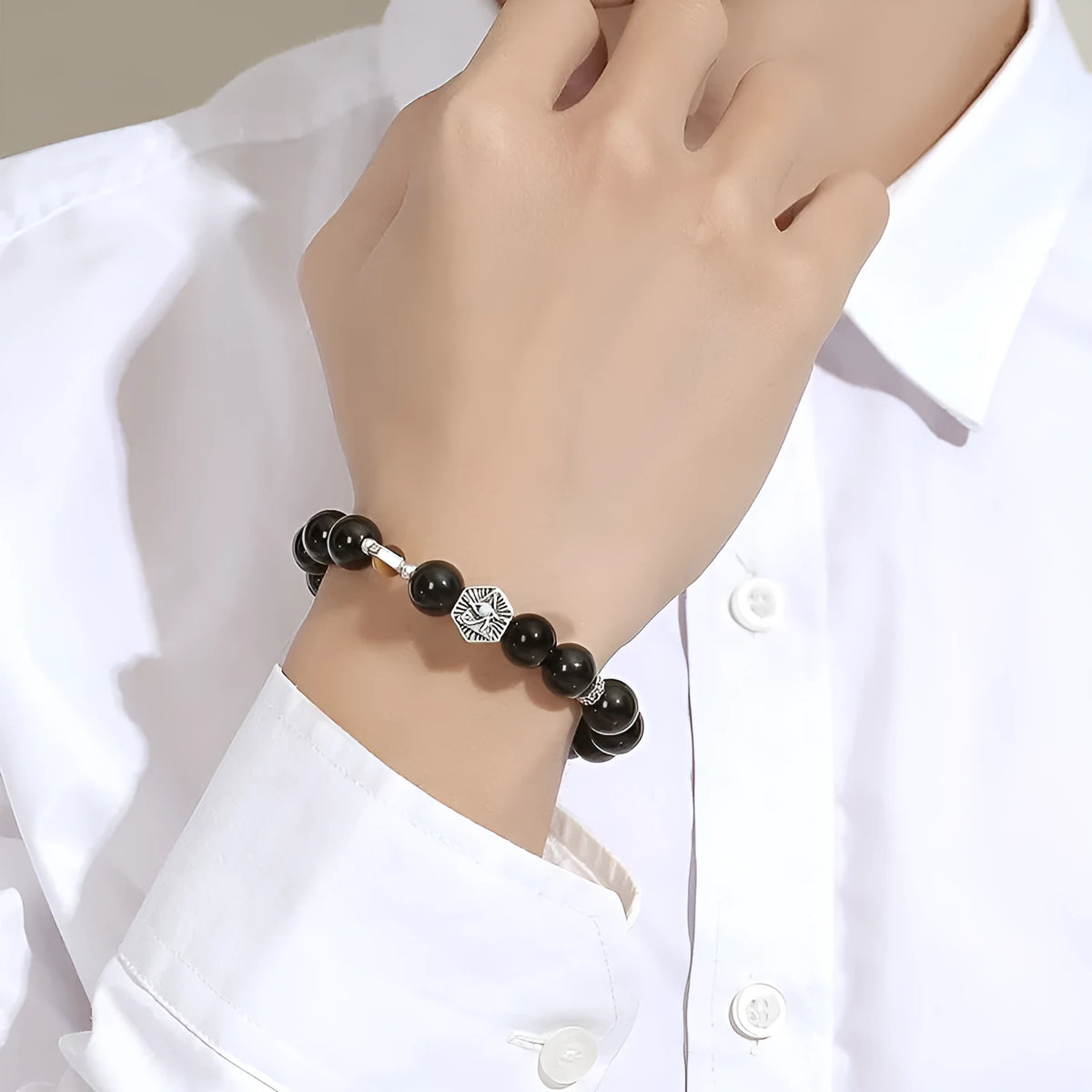 Men's geometric S925 sterling silver bracelet with a central God's Eye obsidian stone inlay.