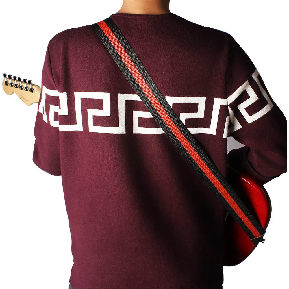 Woven crossbody instrument strap for guitar, bass, and ukulele in multiple colour options.