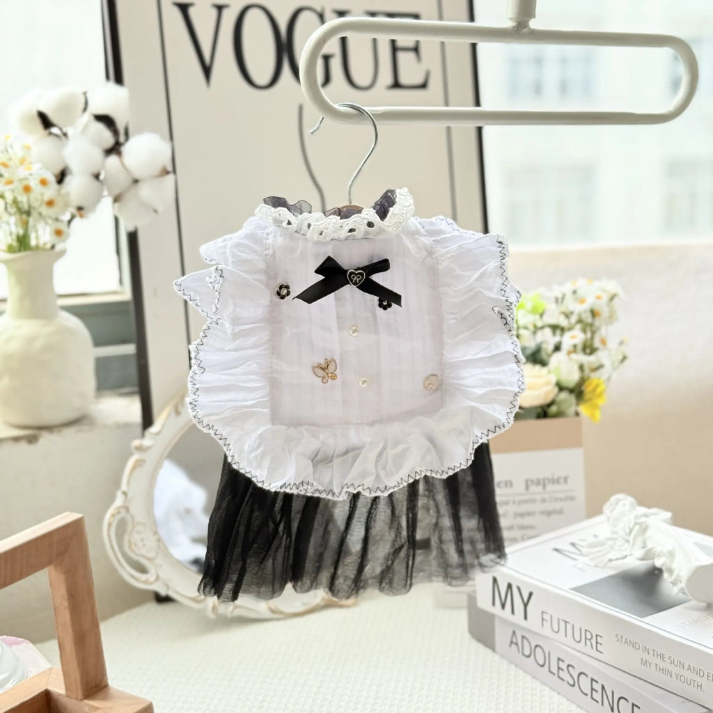 White polyester princess style gauze skirt for a small dog on a hanger, showing the layered skirt design.