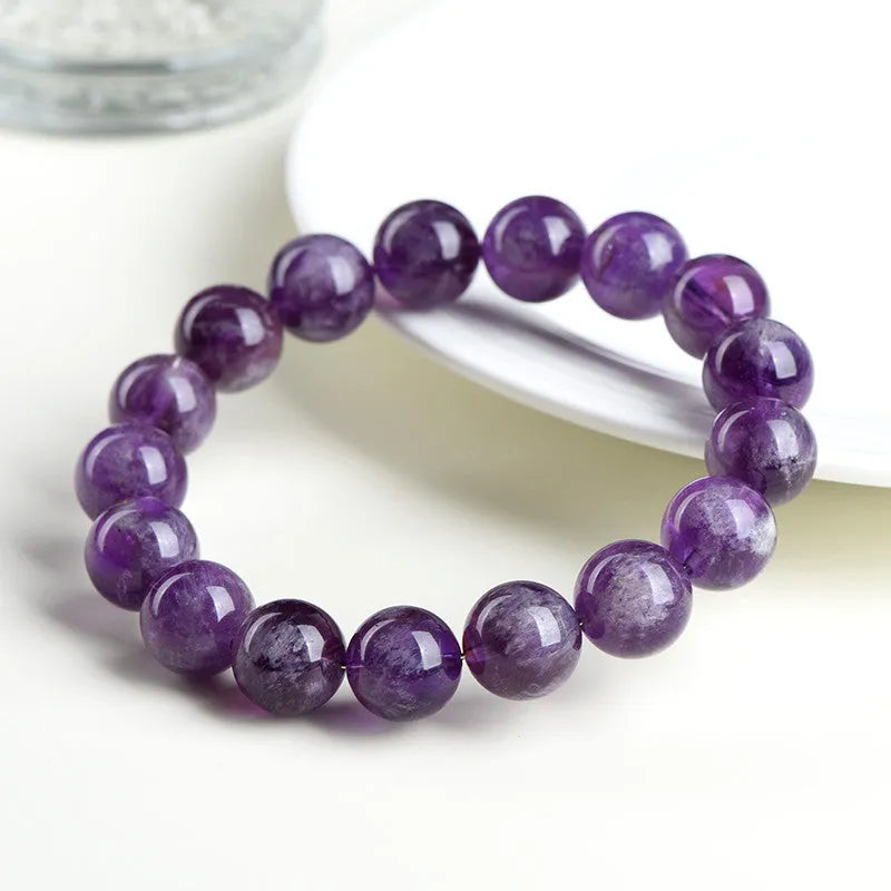 Natural feather amethyst crystal bracelet with Snow Mountain purple scattered beads and a Ruyi geometry design.