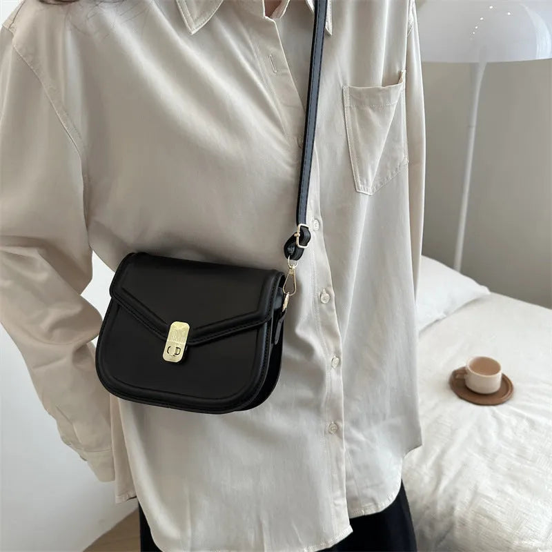 Soft PU leather clamshell shoulder messenger bag in a horizontal square shape.
