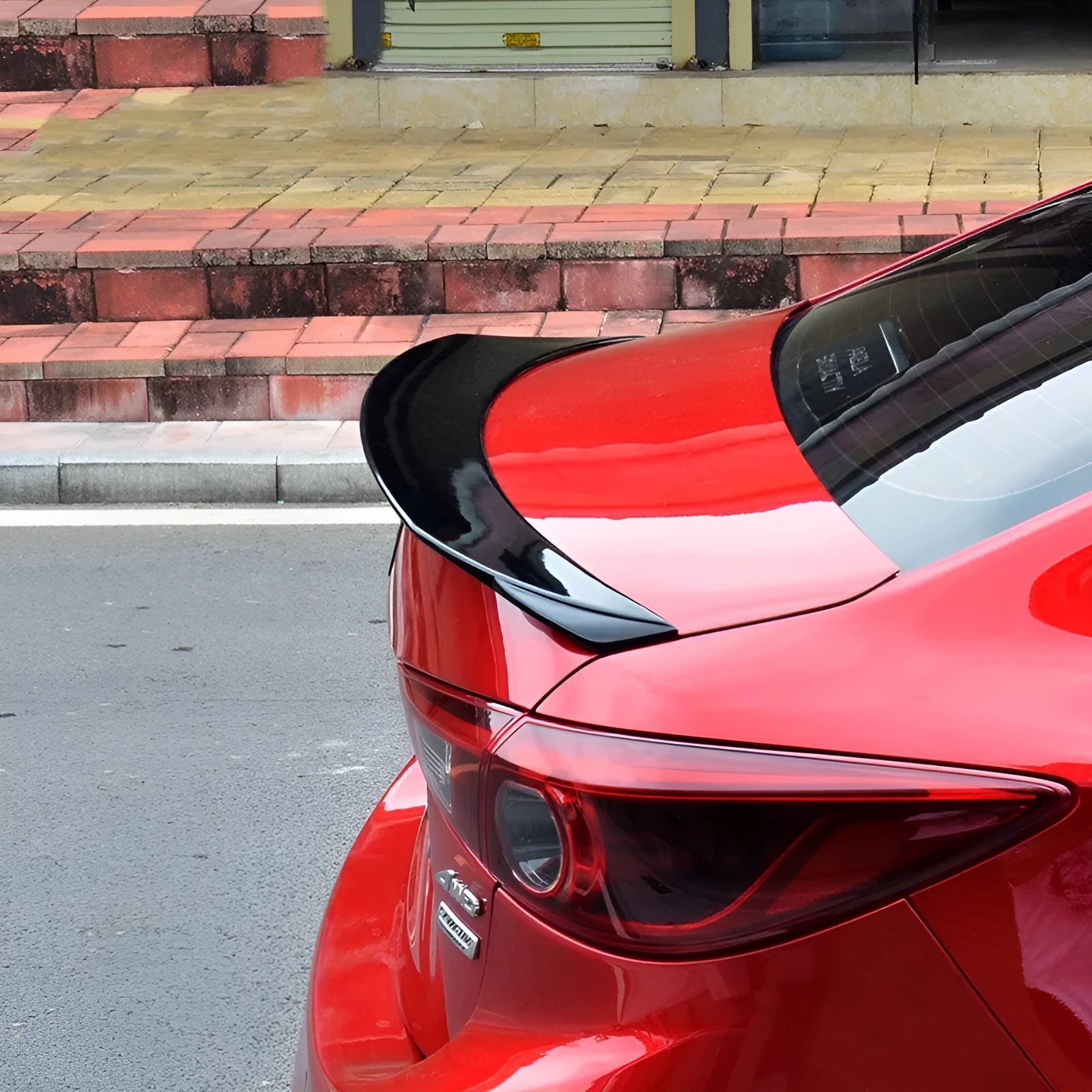 Mazda 3 Exela modified sports tail trim with large fixed wind-surrounded blade in bright black finish