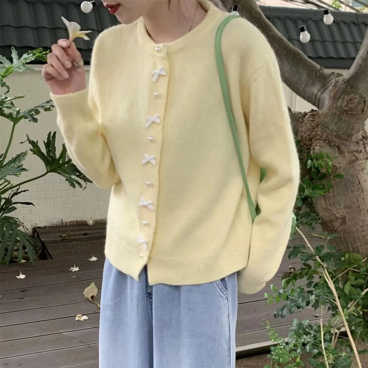 Women's cashmere cardigan sweater with pearl button bow detail in medium thickness for spring and autumn wear