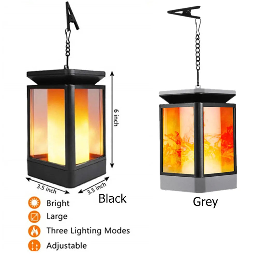 Black antique flame styled outdoor solar LED garden lamp with solar panel on top.