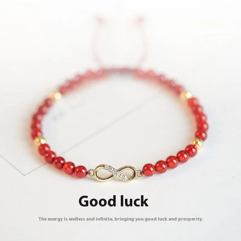 Hand-woven ethnic bracelet with natural red agate beads in diamond shapes showing woven pattern detail
