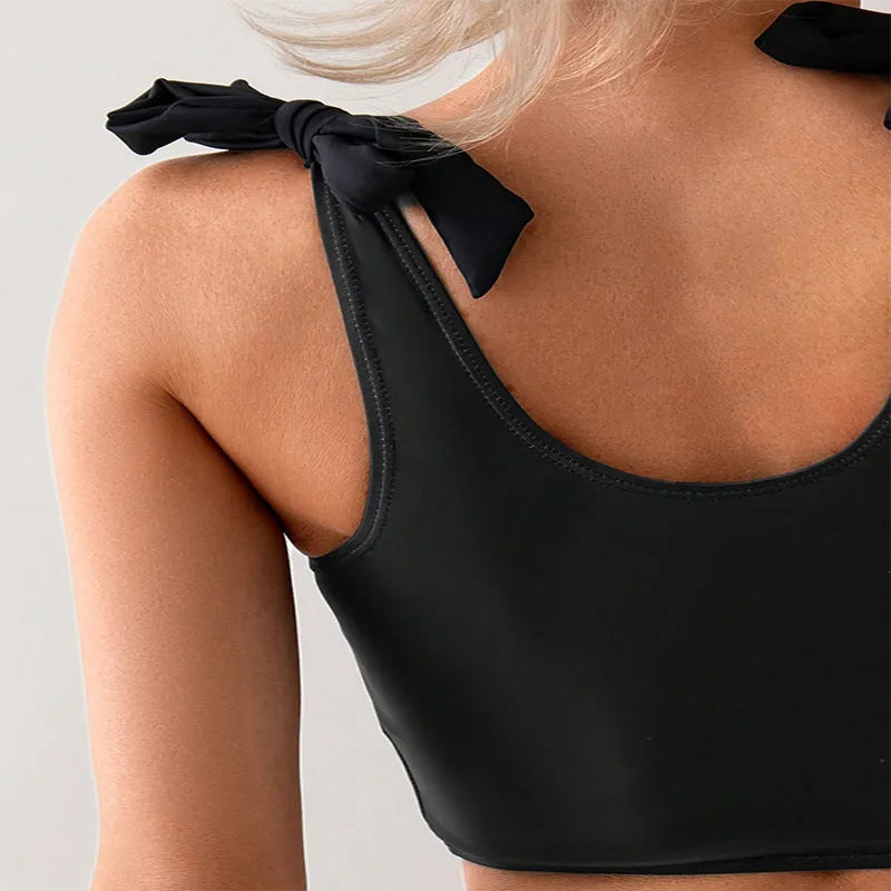 Women's coconut print bikini swimsuit with lace-up back design on hanger