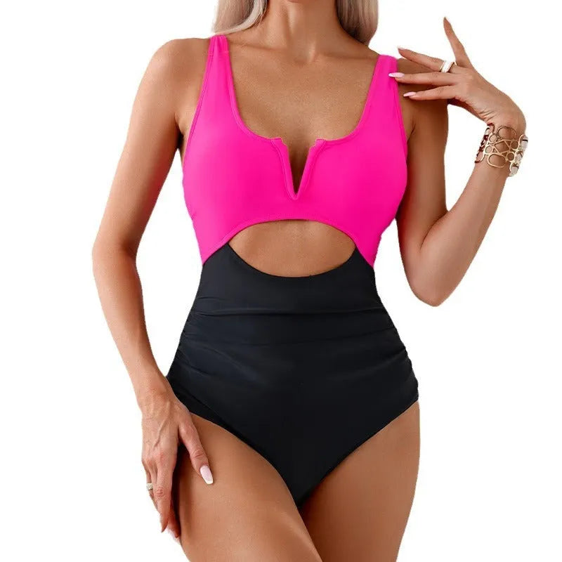 Women's one-piece swimsuit with contrast colour block design in nylon fabric.