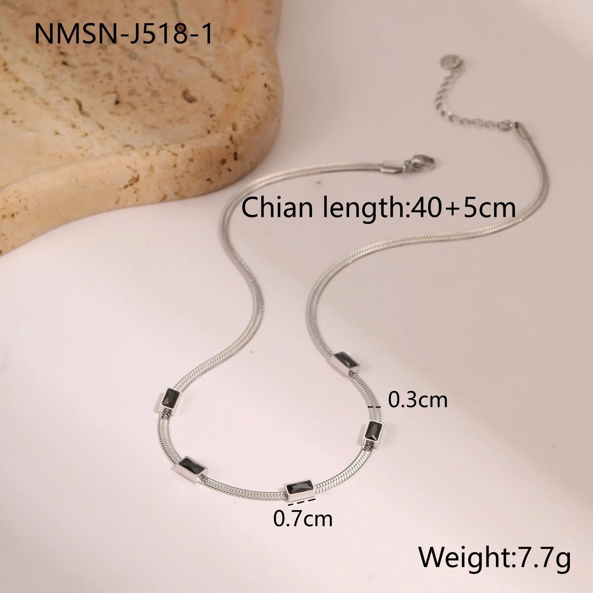 Retro geometric square zircon pendant on a stainless steel flat snake necklace chain.