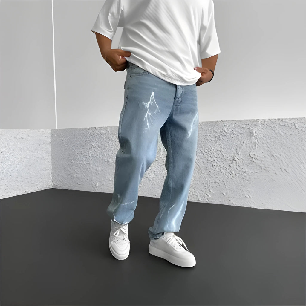 Men's blue straight-leg loose wide-leg denim jeans on a neutral background
