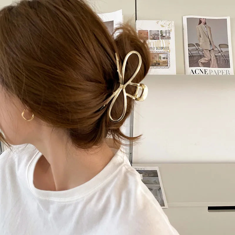 Alloy metal bow hair clip for women in silver or gold colour, Korean style.