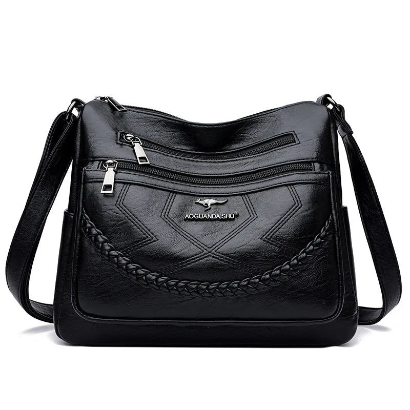 Soft PU leather crossbody shoulder bag in a horizontal square shape, shown in one of four colours: black, blue, red, or yellow.