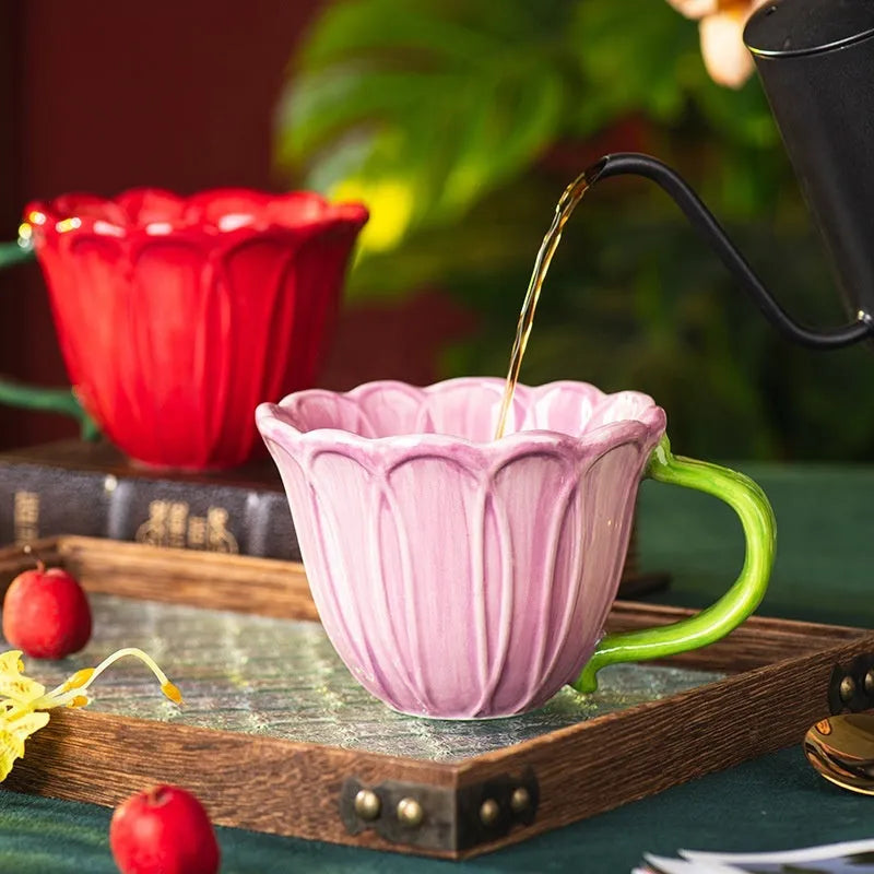 Ceramic breakfast cup with floral pastoral design showing red and purple colour options