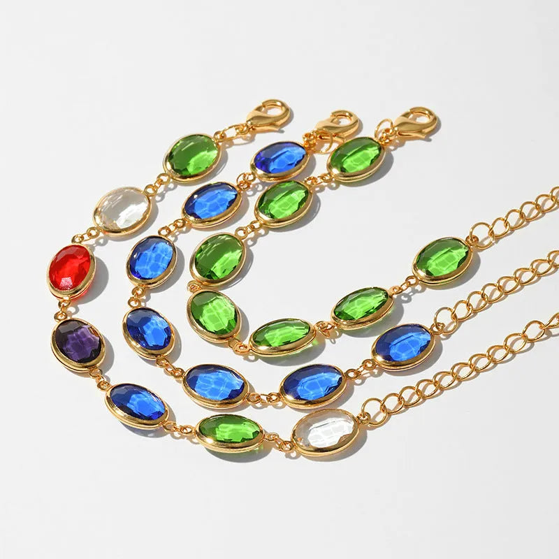 Geometric copper bracelet with glass inlay in blue, green, and multicolor options showing ellipse design elements
