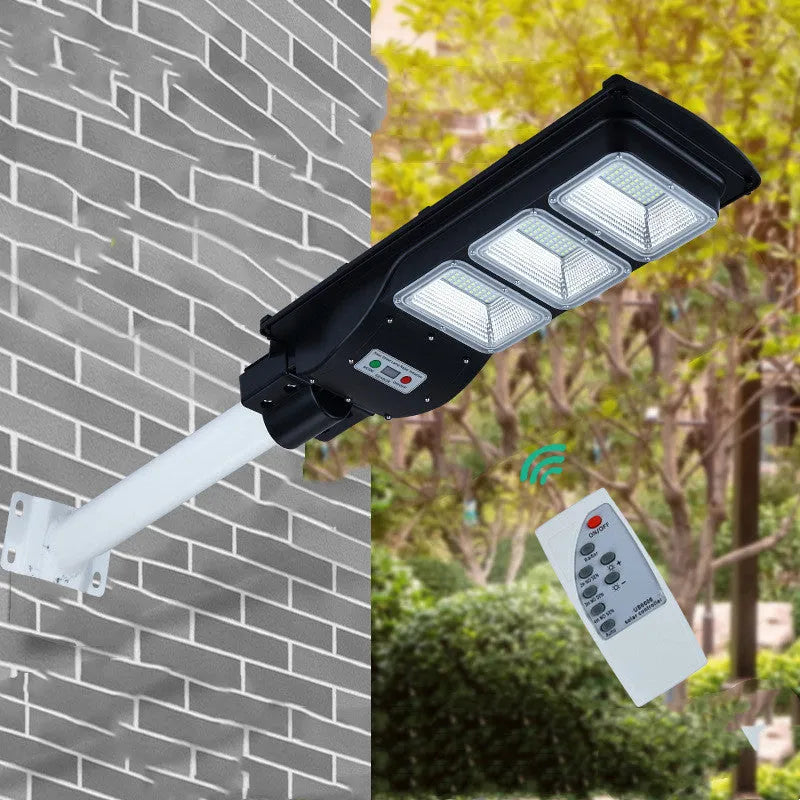 Integrated solar street light with solar panel and LED light in single housing unit for outdoor installation