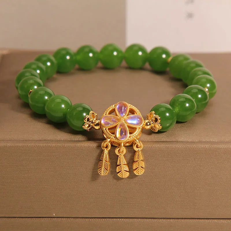 Green jasper crystal bracelet with four-leaf clover dream catcher pendant for women.