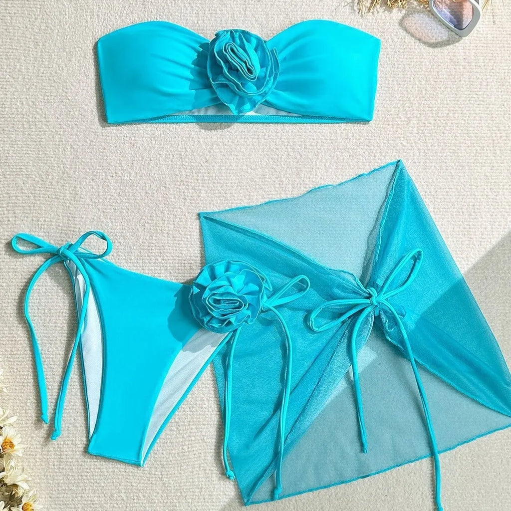 Women's tube top swimsuit with three-dimensional flower tie detail in pink, blue, purple colours