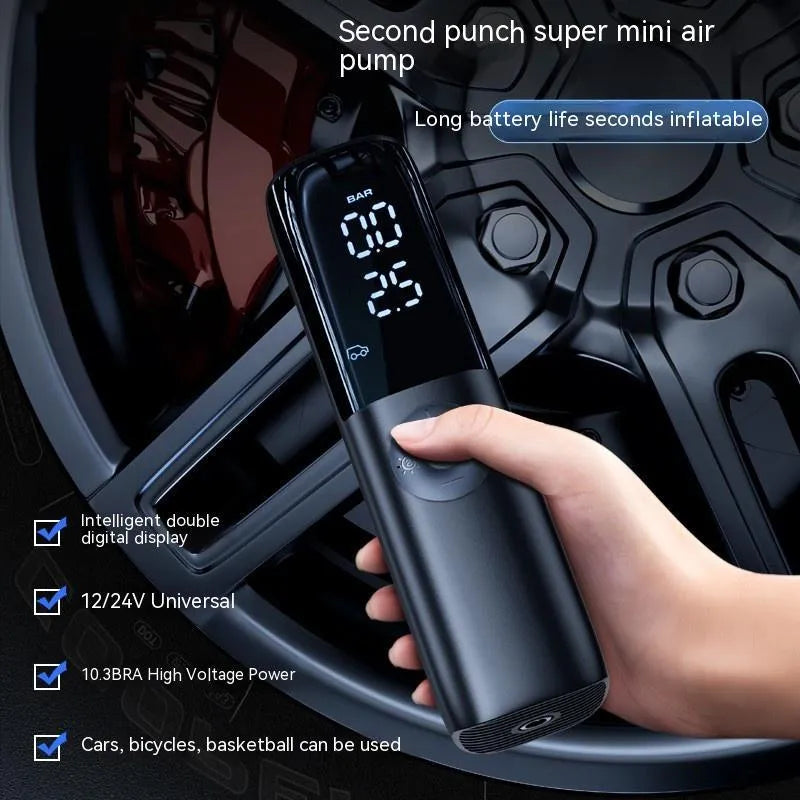 Black portable car air pump with tyre pressure gauge and inflation tube